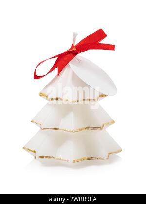 Vanilla scented candle in the shape of a Christmas tree with a red bow, isolated on a white background Stock Photo