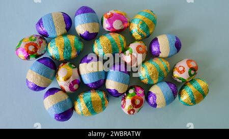 A closeup of colorful chocolate Easter eggs on the table. Stock Photo