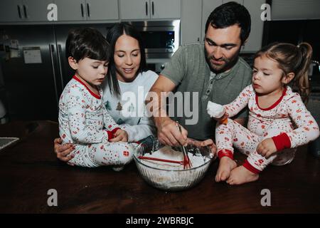 Family preps for baking fun Stock Photo