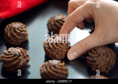 Chocolate brownie is on a baking sheet Stock Photo