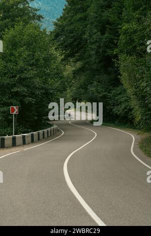 winding road in mountain forest Stock Photo