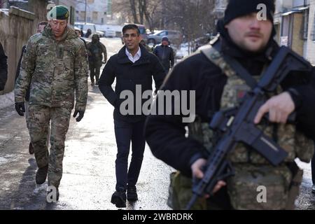 Prime Minister Rishi Sunak and Vice Chief of the Defence Staff, Major General Gwyn Jenkins (left), are shown damaged buildings in Kyiv, Ukraine, ahead of meeting with President Volodymyr Zelensky to announce a major new package of military aid to Ukraine. Picture date: Friday January 12, 2024. Stock Photo