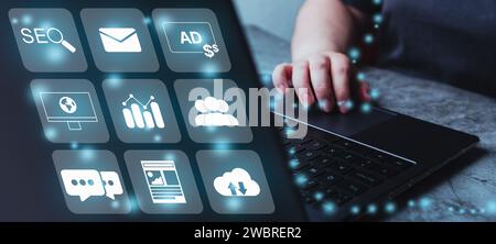 Woman use laptop with digital online marketing technology concept interface. Search Engine Optimisation. SEO. SMM. Customer network connection. Stock Photo