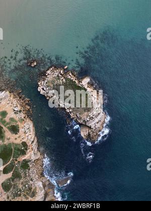 Aerial view of the rugged coastline with turquoise waters, rocky cliffs ...