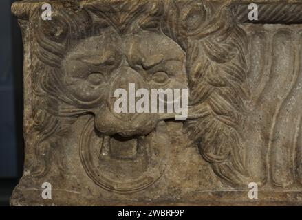 Sarcophagus of the Lions. Decorated with lion heads and strigils. Marble. 2nd century AD. External dimensions: 2.45 m. (length), 0.90 m. (width) and 0.55 m. (height). Detail. From Evora, Portugal. National Archaeology Museum. Lisbon, Portugal. Stock Photo