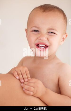 Sad, crying and portrait of boy baby by his mom with unhappy, upset and naughty personality. Tired, annoyed and face of disappointed child, infant or Stock Photo