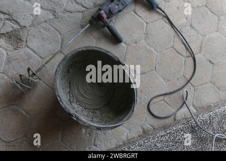 Bucket cement mix with on construction site the ingredients. Brick, Stone,  Mortar, Sand Stock Photo - Alamy