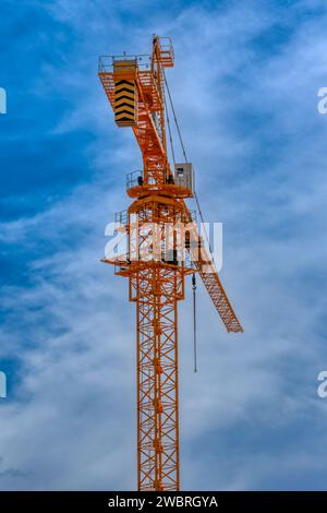 yellow crane against the blue sky Stock Photo