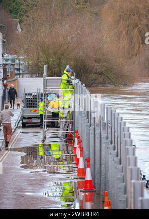 Bewdley, UK. 3rd January, 2024. UK weather: After many days of rainfall, flood waters hit close to record levels in Bewdley. With flood water quickly rising in Bewdley on the River Svern the Environment Agency act swiftly to raise the flood barriers to their highest level. Credit: Lee Hudson/Alamy Stock Photo