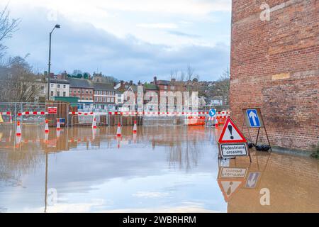 Bewdley, UK. 3rd January, 2024. UK weather: After many days of rainfall, flood waters hit close to record levels in Bewdley. With flood barriers only installed on one side of the river the flood water is able to encroach into properties around Beales Corner in Bewdley. Credit: Lee Hudson/Alamy Stock Photo