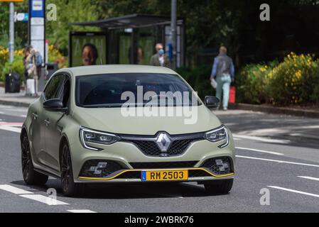 Luxembourg City, Luxembourg - Military green matte Renault Mégane IV RS driving on the street. Stock Photo