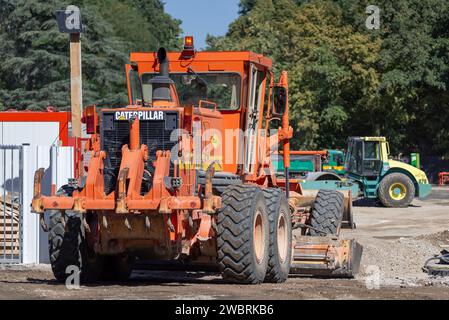 Nancy, France - Orange motor grader CAT 140H on construction site. Stock Photo