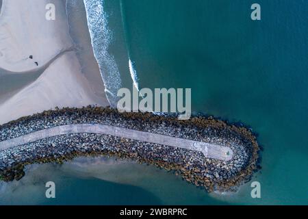zenithal aerial drone view of a concrete block breakwater. Vila Praia de Ancora, Portugal Stock Photo