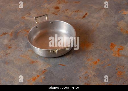 Shiny aluminum saucepan, ideal for stylish cooking. Elevate your