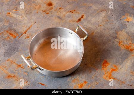 Shiny aluminum saucepan, ideal for stylish cooking. Elevate your