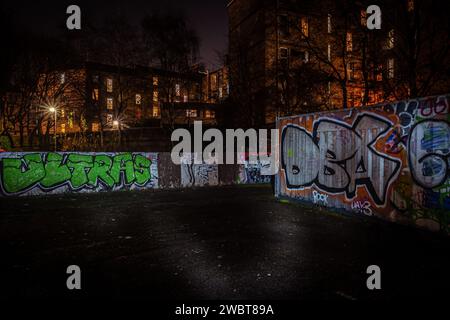 City nights tell tales in spray paint and shadows Stock Photo