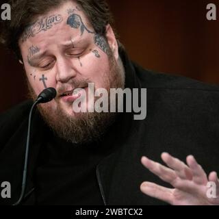 Washington, United States. 11th Jan, 2024. Artist and Philanthropist Jason 'Jelly Roll' DeFord appears before a Senate Committee on Banking, Housing, and Urban Affairs hearing to examine stopping the flow of fentanyl, focusing on public awareness and legislative solutions, in the Dirksen Senate Office Building in Washington, DC, Thursday, January 11, 2024. Photo by Rod Lamkey/CNP/ABACAPRESS.COM Credit: Abaca Press/Alamy Live News Stock Photo
