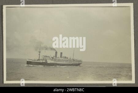 Passenger ship with a smoking chimney at sea, Anonymous, 1920 - 1930 photograph Part of the Dutch East Indies family album.  photographic support gelatin silver print passenger liner (+ view  vehicle, ship, etc.) Stock Photo