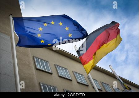 Dresden, Germany. 18th Dec, 2023. The European flag and the German flag wave in the wind in front of the Saxon State Parliament in Dresden. Credit: Heiko Rebsch/dpa/Alamy Live News Stock Photo