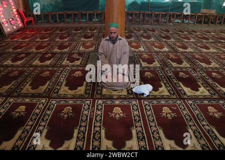 January 12,2024, Srinagar Kashmir, India : A man prays at the Jamia ...