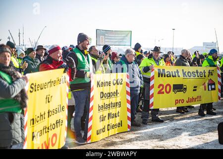 On January 12, 2024, thousands of participants gathered on the Theresienwiese in Munich, Germany, together with the Association of Transport and Logistics Companies ( BGL Süd ) and the Bavarian Transport and Logistics Association ( LBT ) e.V. to demonstrate against the traffic light government. to demonstrate against the traffic light government. The majority of participants arrived in their own trucks, tractors, construction vehicles or similar. Over 1800 vehicles took at the assembly point. The demonstration was part of the farmers' protest week. (Photo by Alexander Pohl/Sipa USA) Stock Photo