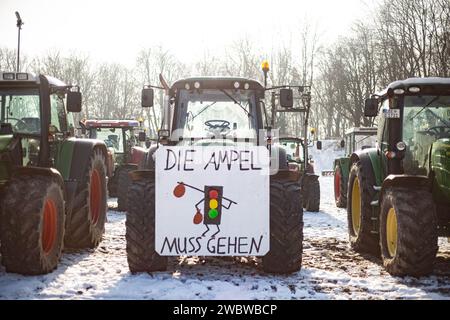 On January 12, 2024, thousands of participants gathered on the Theresienwiese in Munich, Germany, together with the Association of Transport and Logistics Companies ( BGL Süd ) and the Bavarian Transport and Logistics Association ( LBT ) e.V. to demonstrate against the traffic light government. to demonstrate against the traffic light government. The majority of participants arrived in their own trucks, tractors, construction vehicles or similar. Over 1800 vehicles took at the assembly point. The demonstration was part of the farmers' protest week. (Photo by Alexander Pohl/Sipa USA) Stock Photo