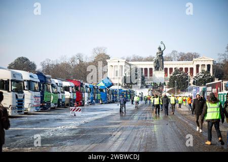 On January 12, 2024, thousands of participants gathered on the Theresienwiese in Munich, Germany, together with the Association of Transport and Logistics Companies ( BGL Süd ) and the Bavarian Transport and Logistics Association ( LBT ) e.V. to demonstrate against the traffic light government. to demonstrate against the traffic light government. The majority of participants arrived in their own trucks, tractors, construction vehicles or similar. Over 1800 vehicles took at the assembly point. The demonstration was part of the farmers' protest week. (Photo by Alexander Pohl/Sipa USA) Stock Photo