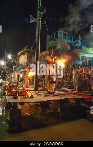 0 05 2005 Hindu priest performs the Ganga Aarti ritual in Varanasi .Fire puja is a Hindu ritual that takes place at Ghat on the banks of the river Gan Stock Photo