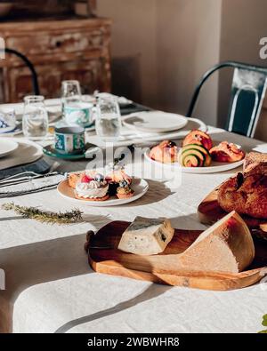 An elegantly set table adorned with a typical Italian breakfast table Stock Photo