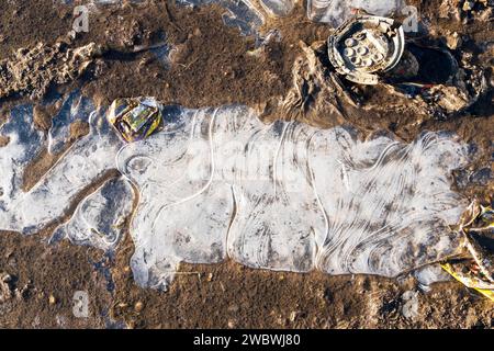 Patterns in frozen ice on a puddle, UK Stock Photo