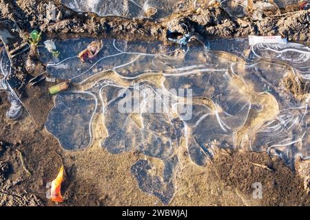 Patterns in frozen ice on a puddle, UK Stock Photo