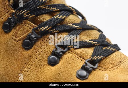 Close up macro of shoelace on yellow nubuck leather boots Stock Photo