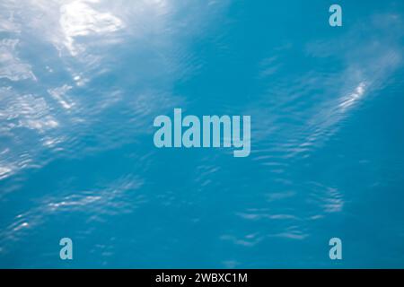 Clear blue tropical ocean surface background with sunlight reflection, Palau Stock Photo