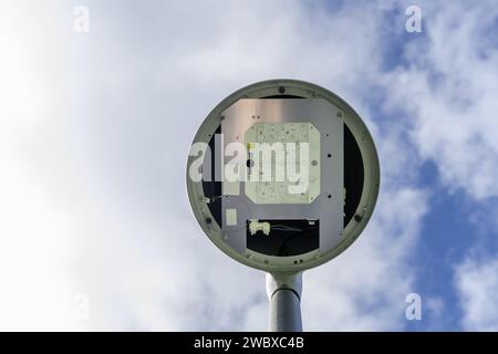 A streetlamp in an urban park with LED bulbs and views of a cloudy sky Stock Photo