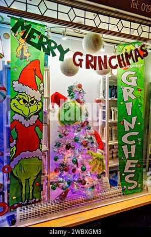 Warminster, Wiltshire, UK - December 26 2022: A Grinch Christmas themed shop window display, Merry Grinchmas Stock Photo