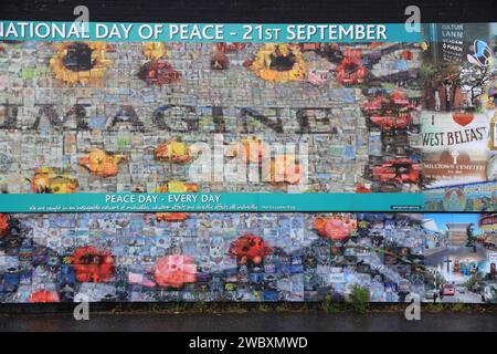 Northumberland Street which runs between loyalist Divis Street & unionist Shankhill Road, known as The International Wall, with it's famous murals, NI. Stock Photo