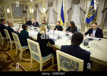 Kiev, Ukraine. 12th Jan, 2024. Ukrainian President Volodymyr Zelenskyy, center right, remarks during a expanded meeting with U.S. Special Representative for Ukraine Economic Recovery Penny Pritzker, left center, at the Mariinskyi Palace, January 12, 2024 in Kiev, Ukraine. Credit: Ukraine Presidency/Ukrainian Presidential Press Office/Alamy Live News Stock Photo
