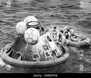 American Astronauts Edwin E. Aldrin, Neil A. Armstrong and Michael Collins in life raft during recovery operation of Command Module Columbia after successful Apollo 11 mission, the first manned lunar mission, Pacific Ocean, NASA, July 24, 1969 Stock Photo