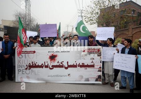 Peshawar, Peshawar, Pakistan. 12th Jan, 2024. Shiite Muslims protest against the death of four people killed including a doctor woman in ParachinarPESHAWAR, PAKISTAN, JANUARY, 12: Pakistani Shiite Muslims, supporters of Imamia Student Organization-ISO, hold a banner and shout slogans during a protest against the sectarian violence inside at Parachinar, in Peshawar, Pakistan, 11 january 2024. A gunman opened fire shots on passenger vehicles near Sada Bazar in Karam district and killed four people including a woman on Sunday. According to the police, the fielder and coach who were going to Pes Stock Photo