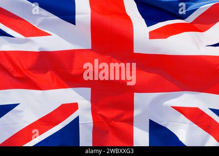 closeup of the national flag of  the UK, the Union Jack, United Kingdom, flapping fluttering moving in the wind Stock Photo