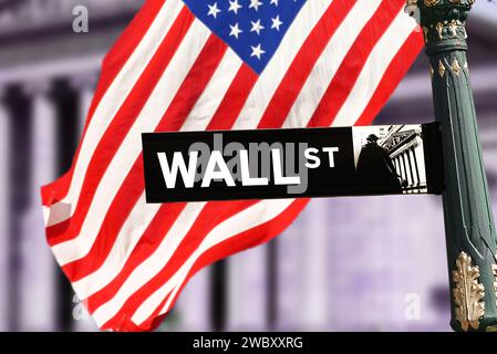 wall street sign with US flag in Manhattan, New York, USA Stock Photo