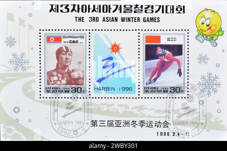 Souvenir Sheet with cancelled postage stamp printed by North Korea, that promotes 3rd Asian Winter Games, Harbin, China, circa 1996. Stock Photo