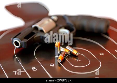 Harrisburg, Nc, USA. 3rd May, 2017. Pistol rests beside bullet-riddled target, silent testimony to precision and power in a canvas of controlled chaos. (Credit Image: © Walter G Arce Sr Grindstone Medi/ASP) EDITORIAL USAGE ONLY! Not for Commercial USAGE! Stock Photo