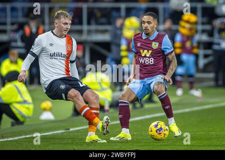 Burnley, UK. 12th Jan, 2024. Turf Moor BURNLEY, ENGLAND - JANUARY 12: Alfie Doughty of Luton Town and Vitinho of Burnley in action during the Premier League match between Burnley FC and Luton Town at Turf Moor on January 12, 2024 in Burnley, England. (Photo by Richard Callis/SPP) (Richard Callis/SPP) Credit: SPP Sport Press Photo. /Alamy Live News Stock Photo