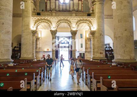 Merida Mexico,centro historico central historic district,Catedral de Merida San Ildefonso cathedral Catholic,inside interior aisle,family parent fathe Stock Photo