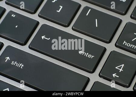 High angle view of a computer keyboard with selective focus on Enter key. Stock Photo
