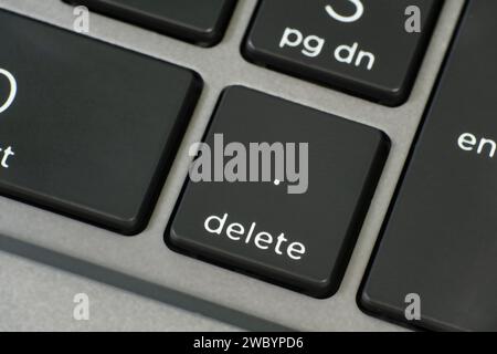 High angle view of a computer keyboard with selective focus on delete key. Stock Photo