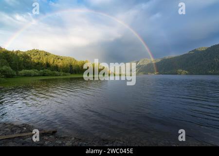 Rainbow over Lake Teletskoye in inclement weather, Russia, Altai Mountains Stock Photo