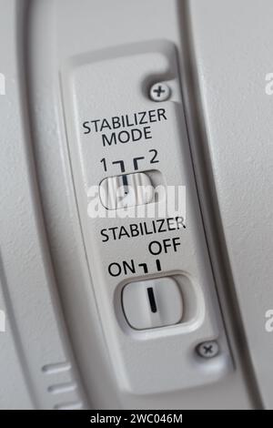Control panel for integrated stabilizer operating modes on a professional lens Stock Photo