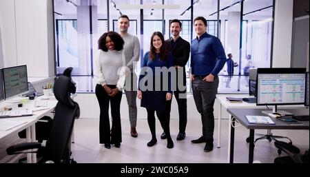 Happy Group Of Business People Standing In Office Stock Photo